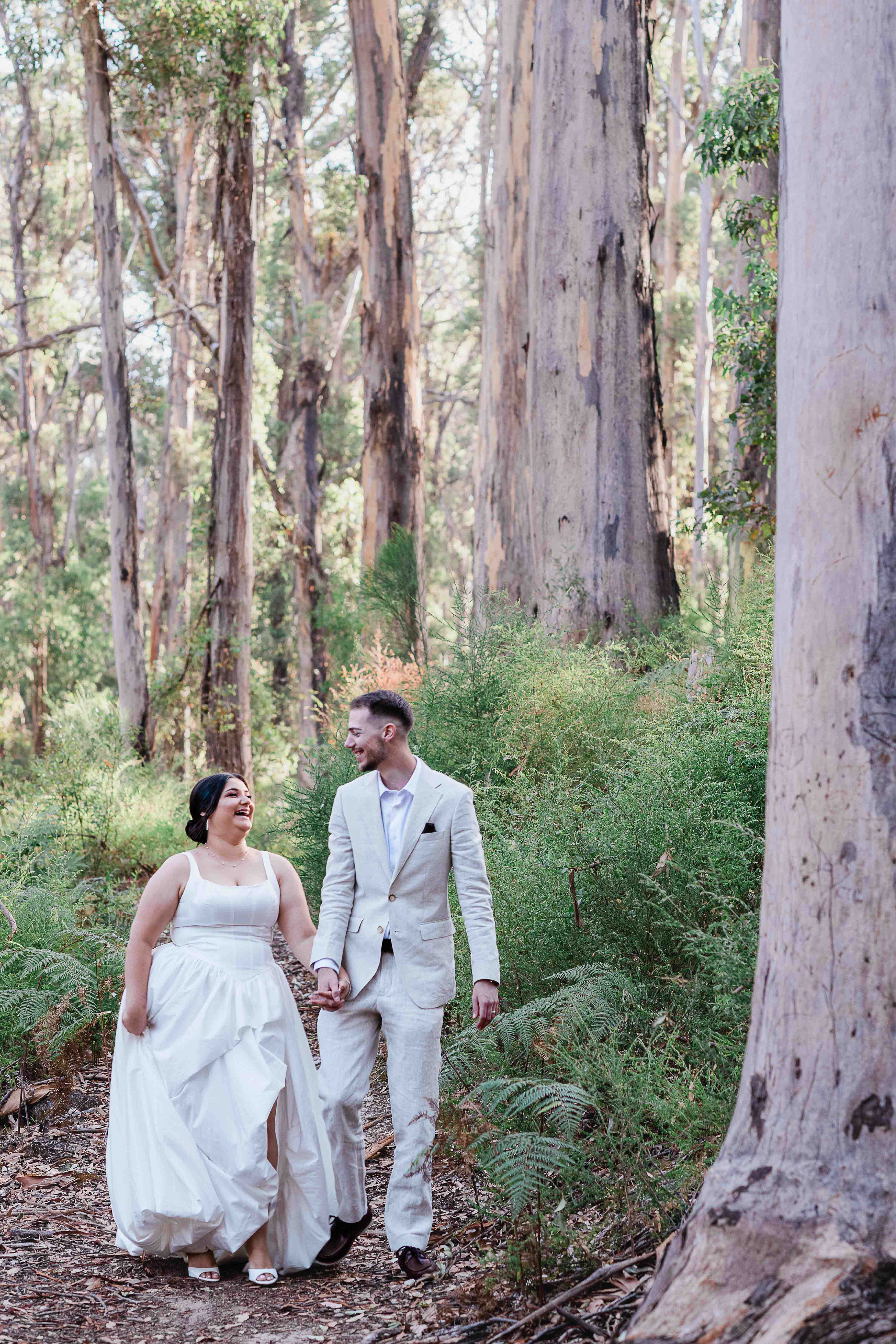 beautiful candid photo of bride looking at groom laughing naturally boranup forest margaret river