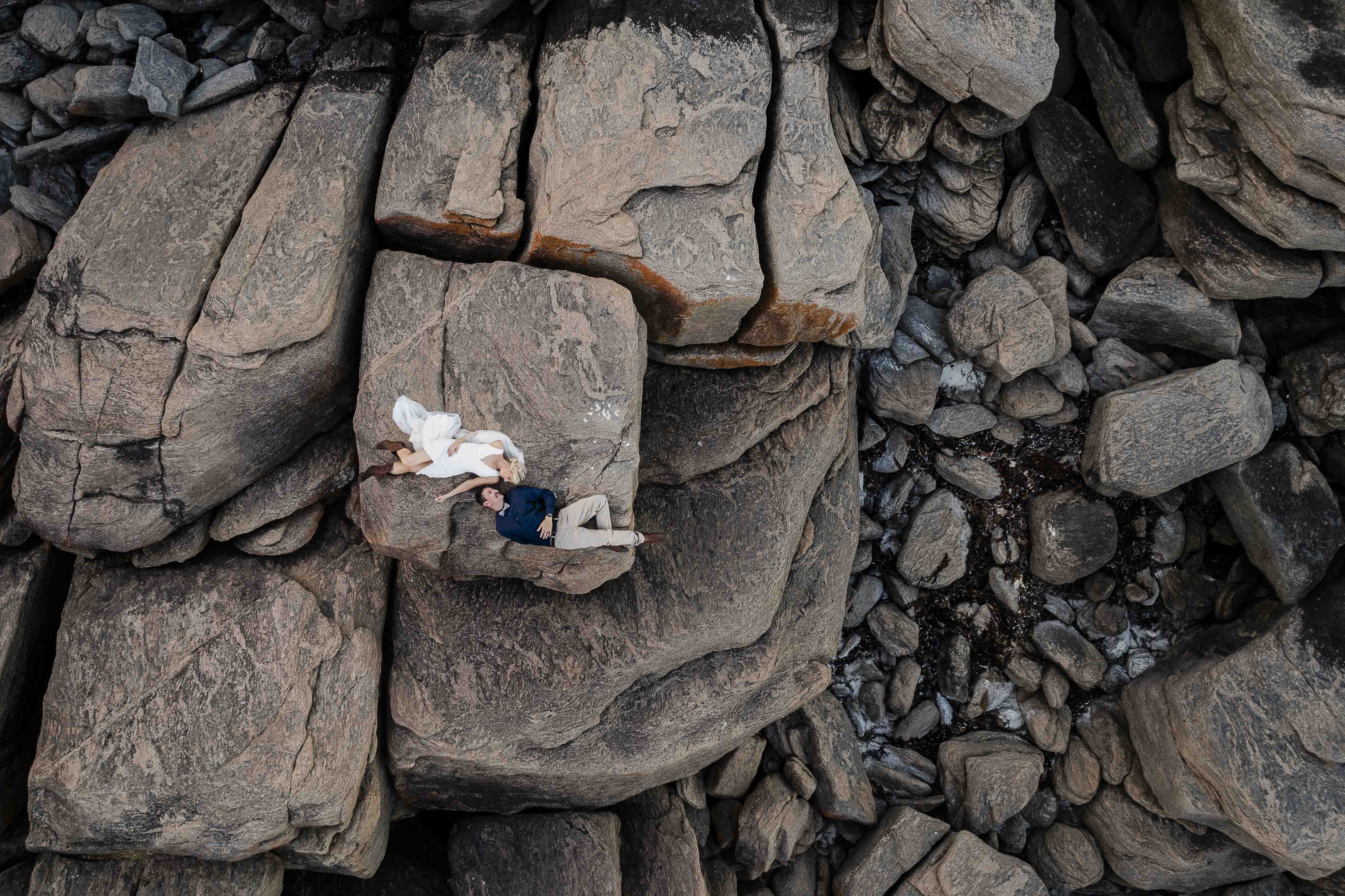 12:21Claude responded: Aerial elopement portrait on granite rocks, South West WA coastline, John Rice PhotographerAerial elopement portrait on granite rocks, South West WA coastline, John Rice Photographer