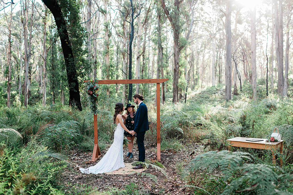 Elopement ceremony in Boranup Forest Margaret River with timber arch native florals and karri forest backdrop planned and photographed by John Rice.