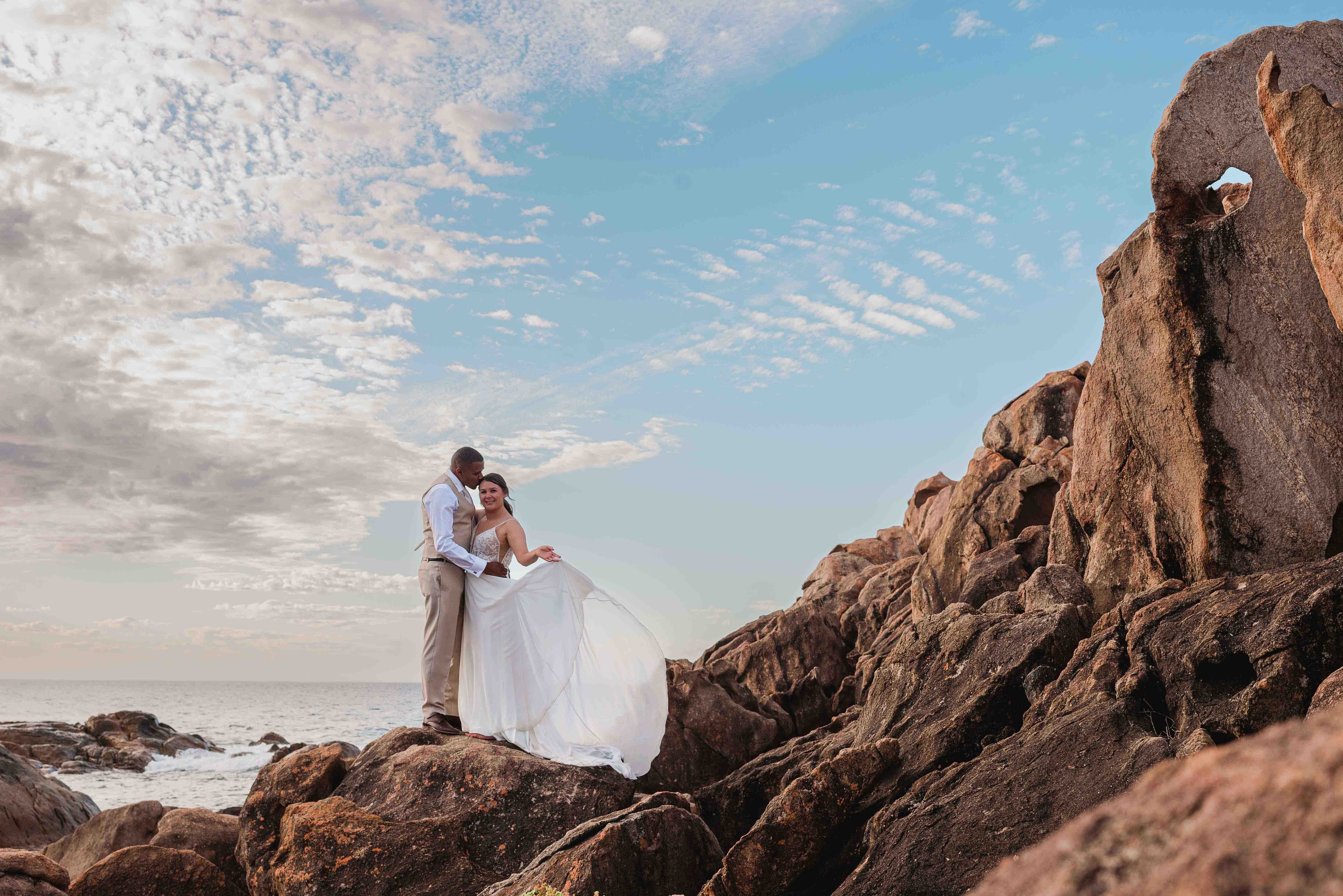 Couple eloping at Redgate Beach, granite rocks, Margaret River, photographed by John Rice
