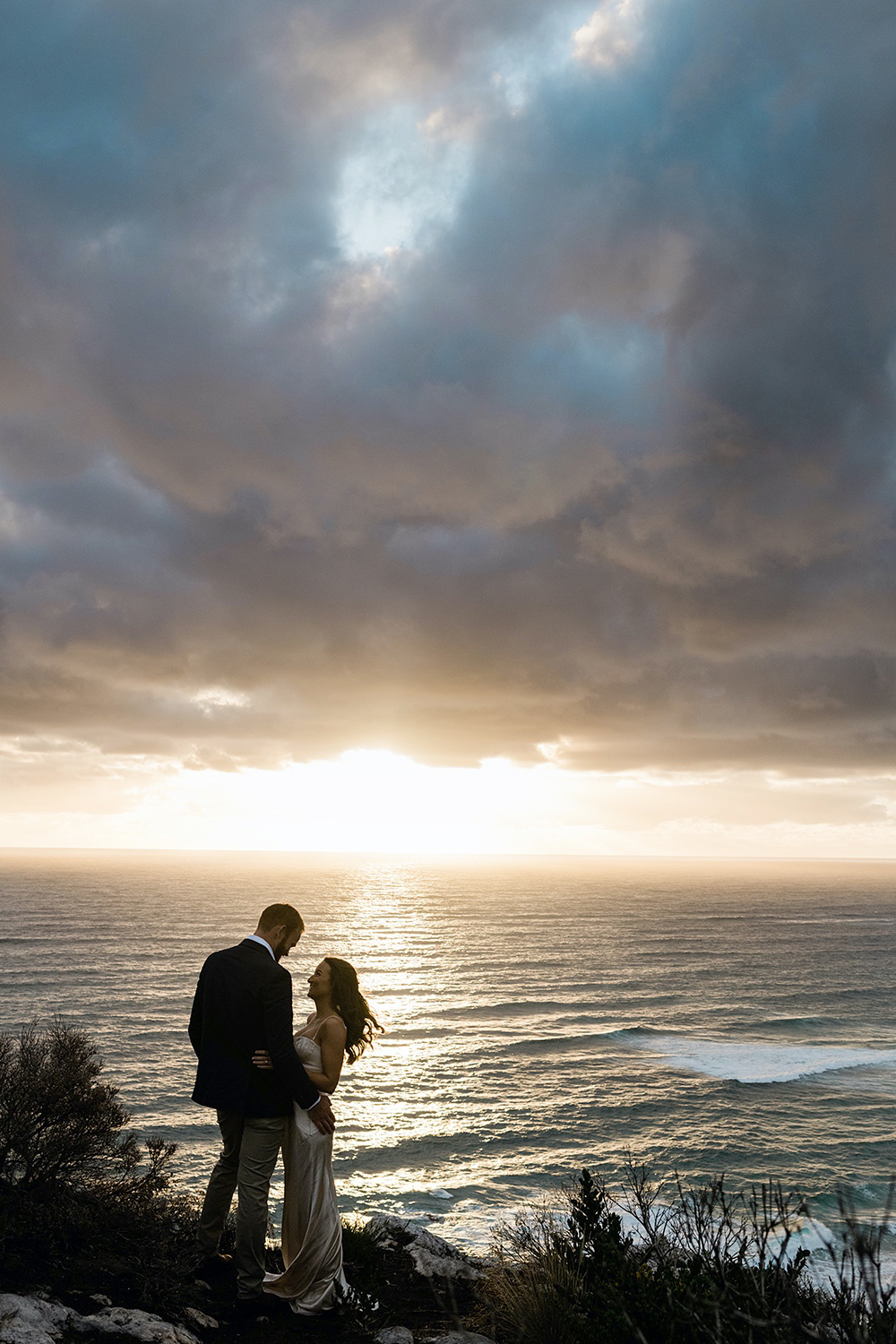 Couple at sunset, Margaret River coastal clifftop, South West WA, photographed by John Rice