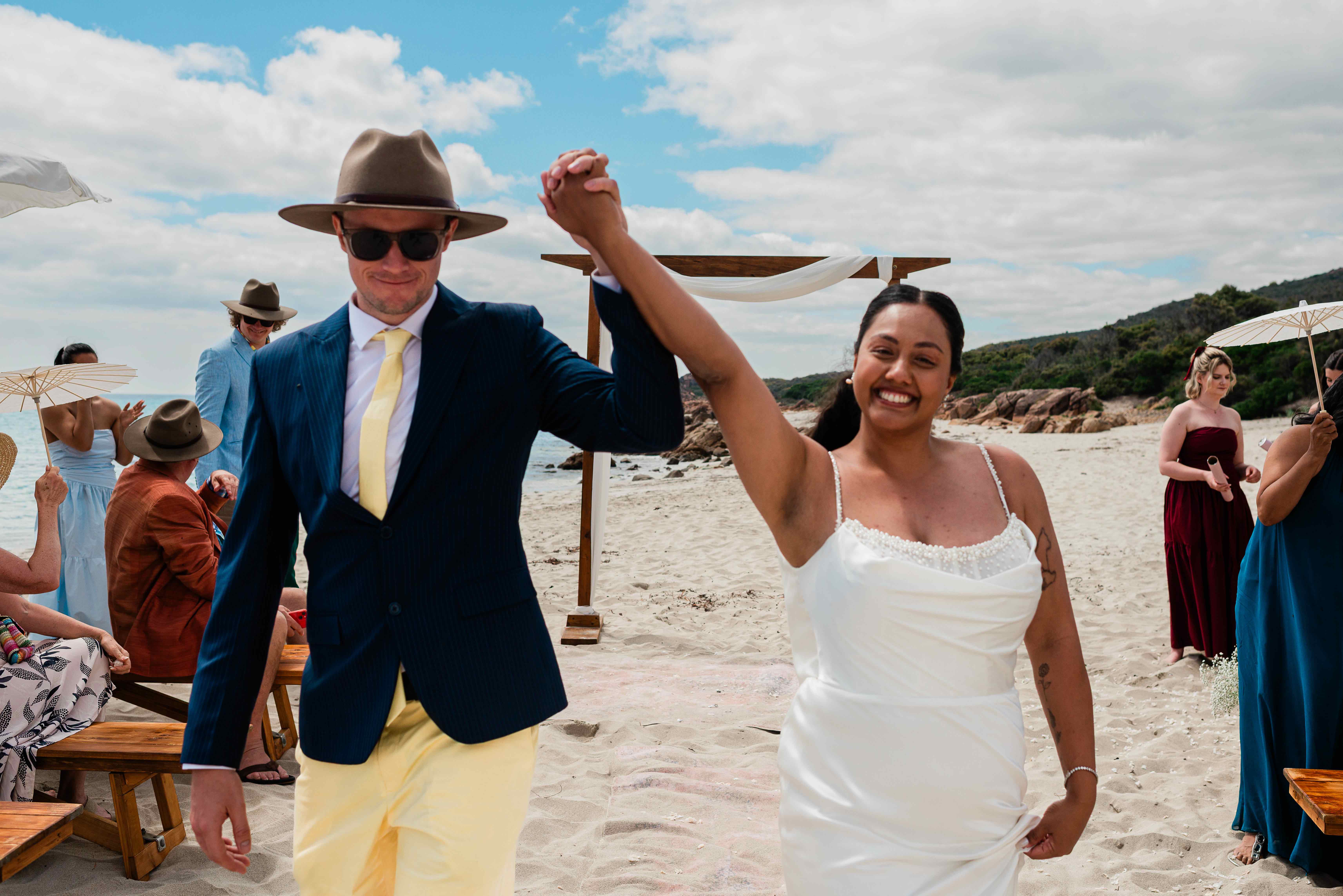 newlyweds walking back down the aisle at a beach micro-wedding, Castle Rock Dunsborough