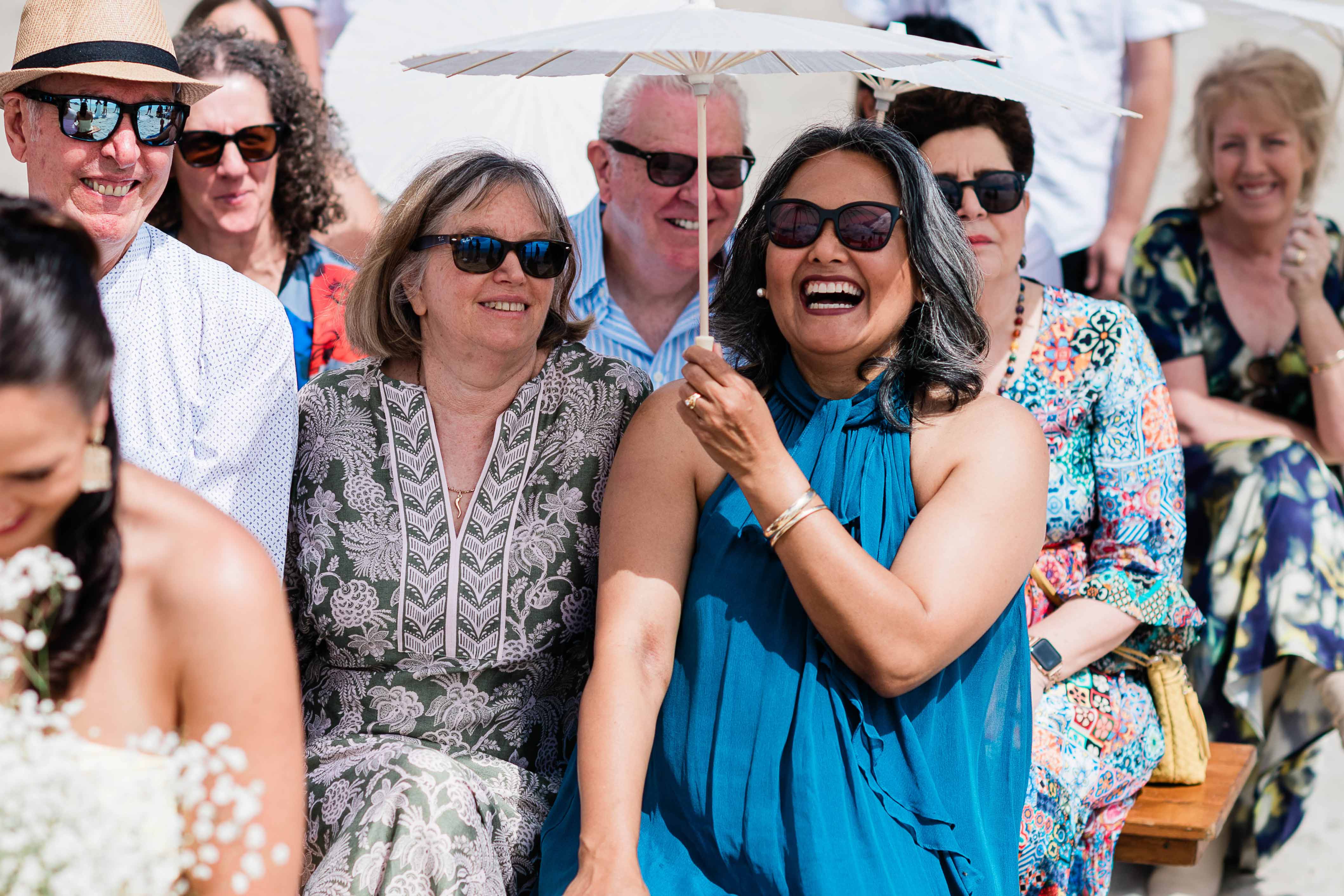 relaxed guests laughing at a beach wedding ceremony near Margaret River